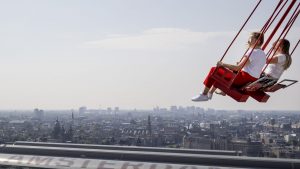 The swings at Amsterdam’s 100m high A’dam Tower offer a panoramic, if scary, view of 
the city and booming Noord. Photo: Robin Van Lonkhuijsen/AFP