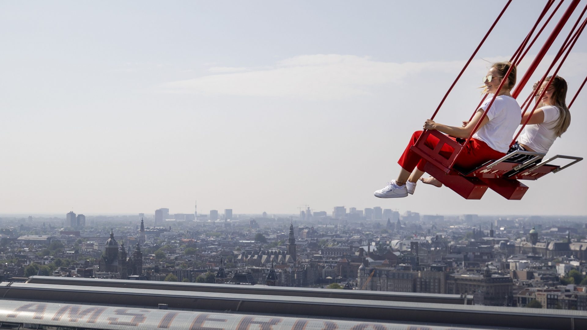 The swings at Amsterdam’s 100m high A’dam Tower offer a panoramic, if scary, view of 
the city and booming Noord. Photo: Robin Van Lonkhuijsen/AFP