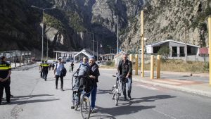 Russian men cross into Georgia at the Larsi border checkpoint between Georgia and Russia, September 28. Photo: Daro Sulakauri/Getty