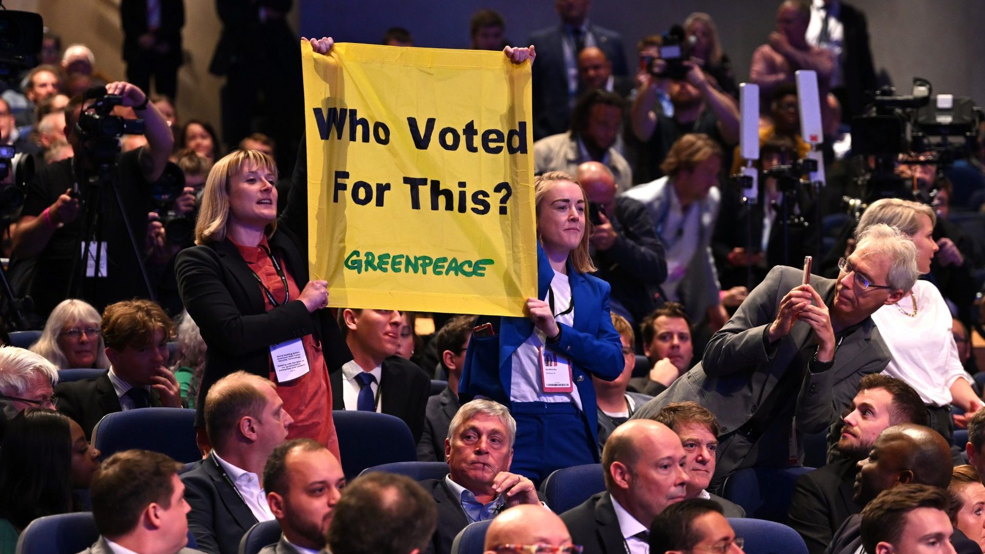 Greenpeace protesters disrupt the prime minister's Liz Truss keynote speech on the final day of the Conservative Party conference (Photo by Leon Neal/Getty Images)