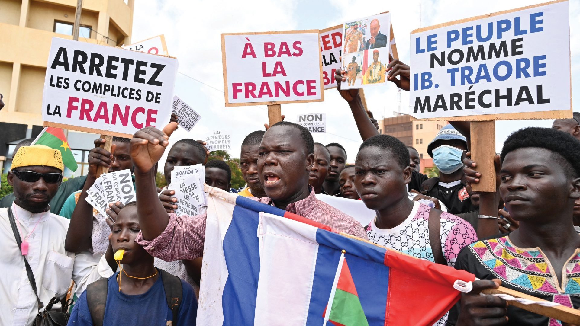 Protesters demonstrate against France and the 
Economic Community 
of West African States in Ouagadougou, Burkina Faso, on October 4, 2022. Photo: Issouf Sanogo/AFP/
Getty