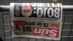 A copy of The Sun newspaper featuring former prime minister Boris Johnson lies on a barrier outside 10 Downing Street in central London on October 21, 2022 (Photo by DANIEL LEAL/AFP via Getty Images)