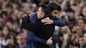 Barcelona's Spanish defender Gerard Pique greets Barcelona's Spanish coach Xavi as he leaves the pitch during the Spanish league football match between FC Barcelona and UD Almeria at the Camp Nou stadium in Barcelona on November 5, 2022. - Barcelona's Pique plays his last match as he announced his retirement after stellar career. (Photo by Josep LAGO / AFP) (Photo by JOSEP LAGO/AFP via Getty Images)