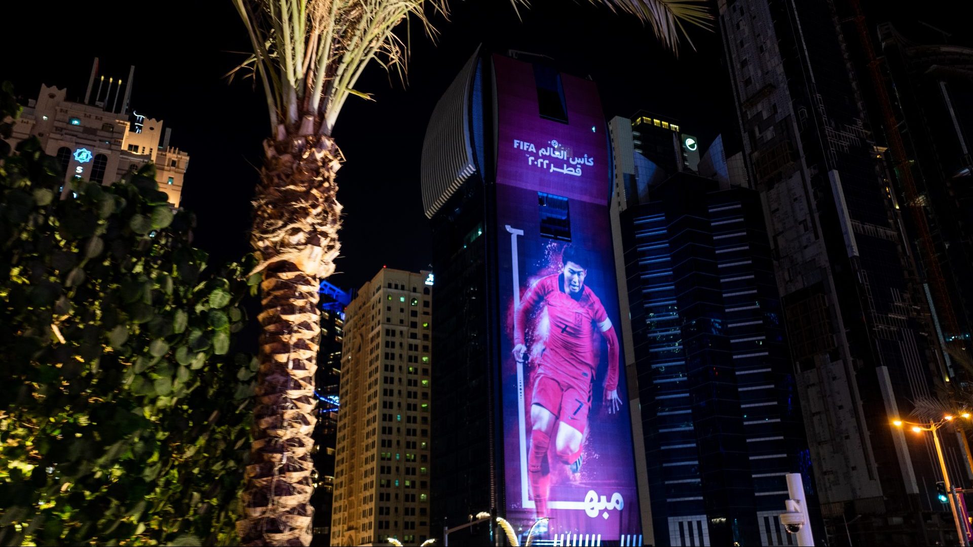 A giant advertising poster of South Korea and Tottenham’s Son Heungmin on a skyscraper in Doha, Qatar. Photo: Robbie Jay Barrett - AMA/Getty