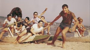 Adriano Celentano (standing) in 1962, not long after he was cast by Fellini in La Dolce Vita. Photo: Giorgio Ambrosi/Mondadori