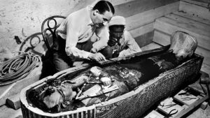 Howard Carter with the sensational find that made him a celebrity in 1922; the golden coffin of Tutankhamun in the 
Valley of the Kings, Egypt. Photo: Harry Burton/Apic/Getty