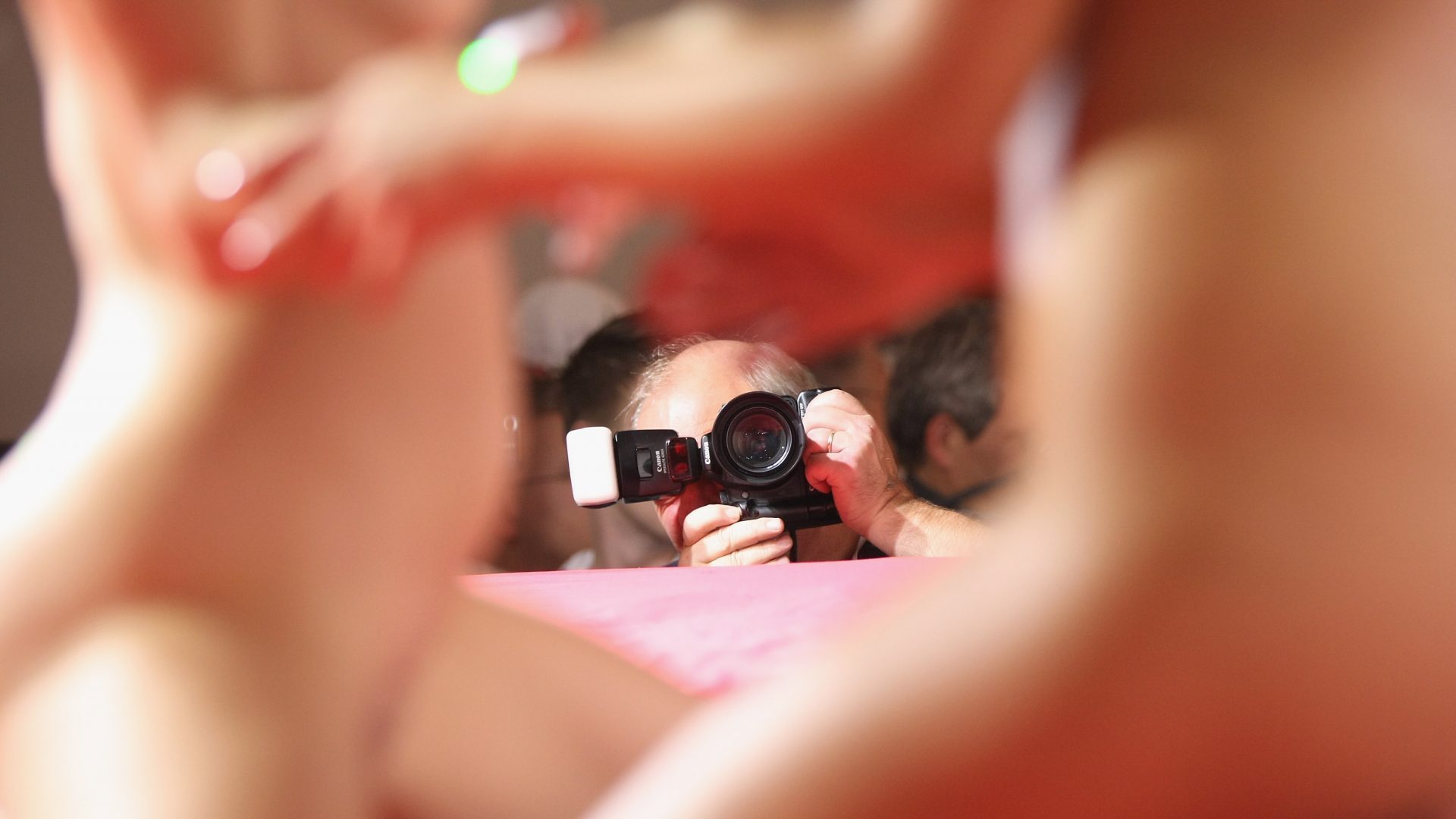 Visitors photograph strippers performing on the industry professionals' day at the 2010 Venus Erotic Fair at Messe Berlin. Photo: Sean Gallup/Getty