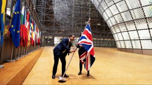 EU officials remove the Union flag from the atrium of the EU Council headquarters in Brussels on January 31, 2020. Photo: Thierry Monasse/Getty