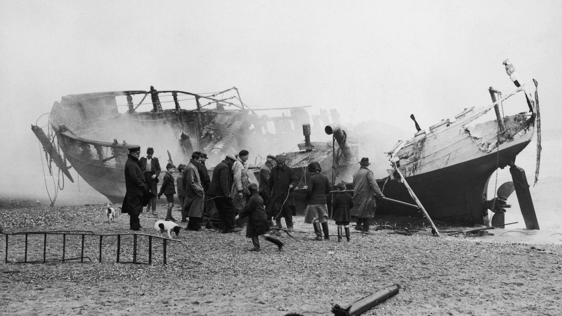 Curious onlookers examine the burning wreck of a trawler in Yorkshire, 1937. Many fishing companies are seeing their future go up in smoke. Photo: Fox Photos/Hulton Archive/Getty