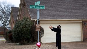 A man prays at a makeshift memorial near the location 
where Tyre Nichols was killed in Memphis. Photo: Joe Raedle/Getty