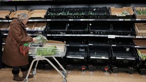 Empty fruit and vegetable shelves at an Asda in east London. Photo: Yui Mok/PA Wire/PA Images
