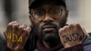 A man attends a housing rights protest in Lisbon organised by a social movement called ‘Fair Life’ (Vida Justa). Photo: Patricia de Melo Moreira/AFP/Getty