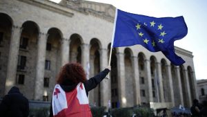 People protest against bill on foreign influence transparency at parliament building in Tbilisi, Georgia. Photo: David Mdzinarishvili/Anadolu Agency via Getty Images 