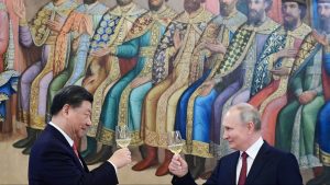 Russian President Vladimir Putin and China's President Xi Jinping make a toast during a reception following their talks at the Kremlin in Moscow on March 21 (Photo by PAVEL BYRKIN/SPUTNIK/AFP via Getty Images)