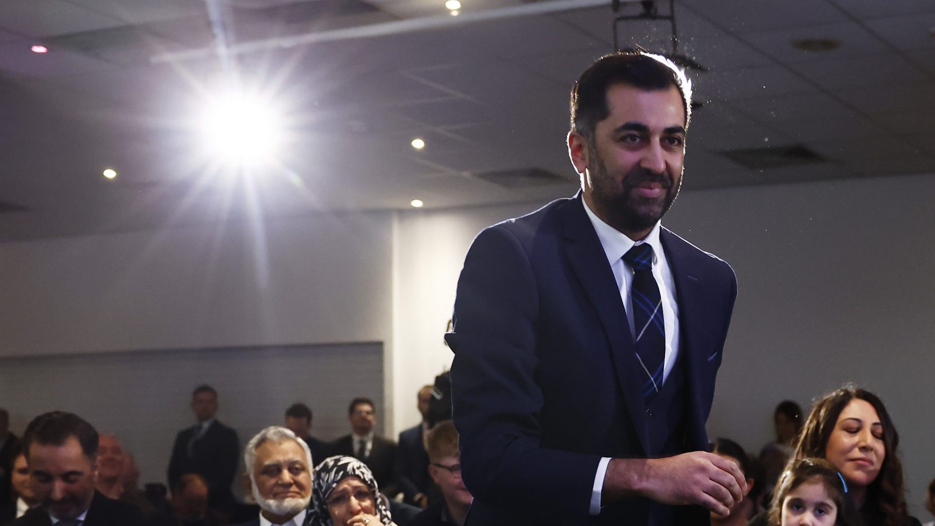 Scotland's health minister and SNP MSP Humza Yousaf walks to the stage to speak after being elected as new party leader (Photo by Jeff J Mitchell/Getty Images)