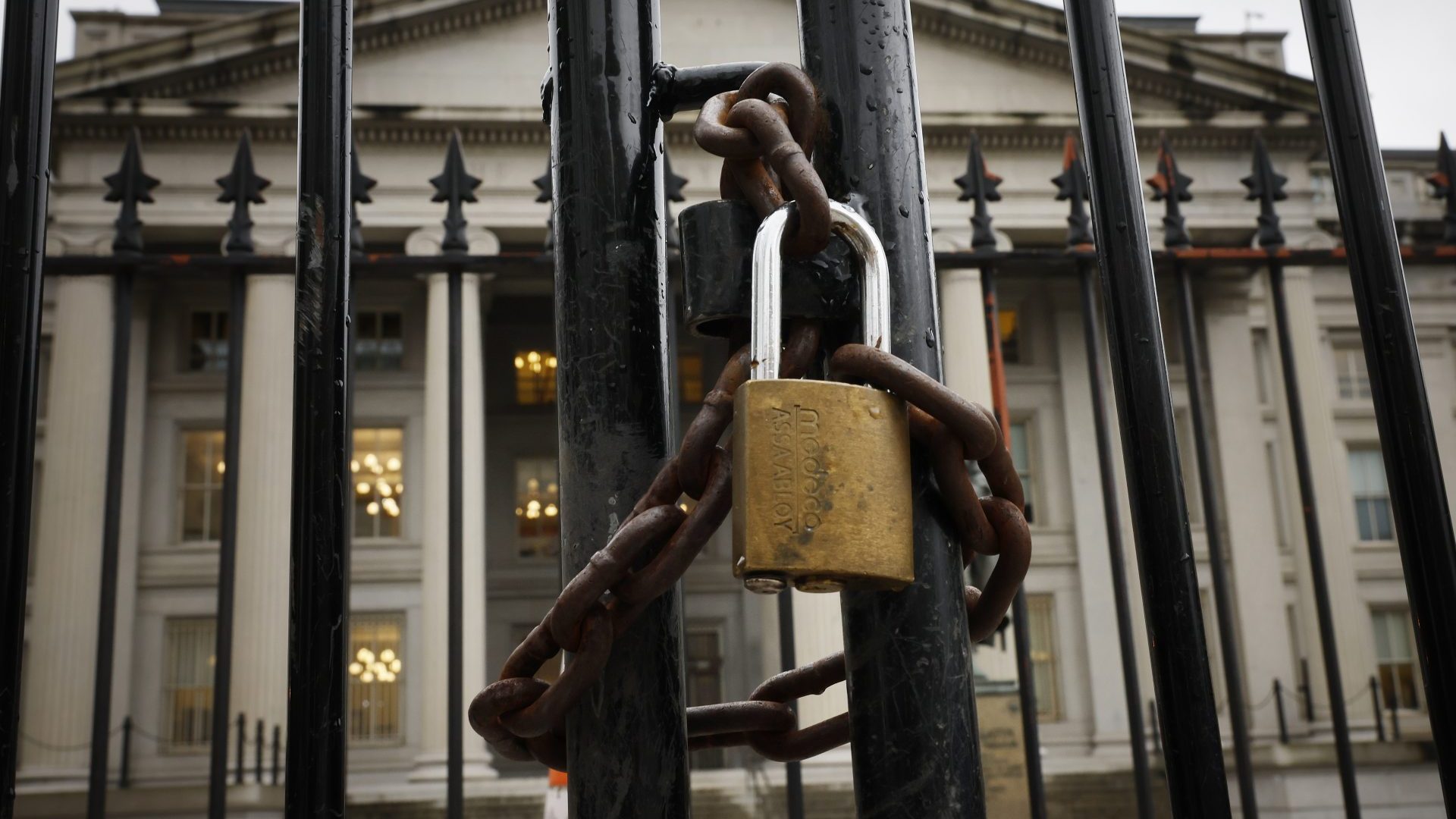 A lock is seen on a gate on the exterior of the U.S. Department of Treasury building as they joined other government financial institutions to bail out Silicon Valley Bank's account holders (Photo by Chip Somodevilla/Getty Images)