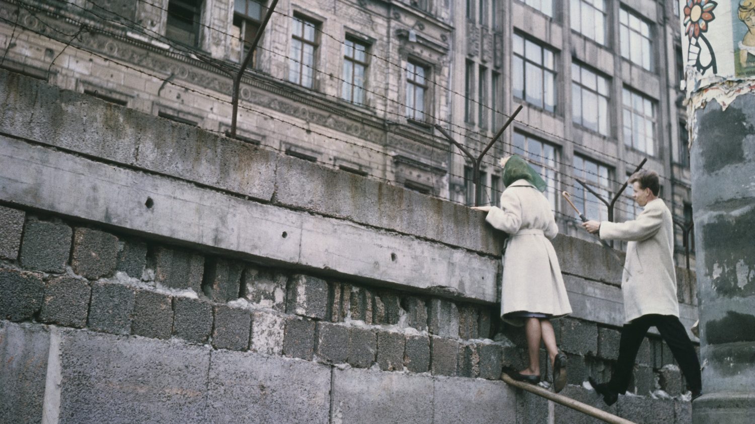 A young West Berlin couple talk to relatives on the other side of the Berlin Wall through an open window, 1962. Photo: Bettmann/Getty