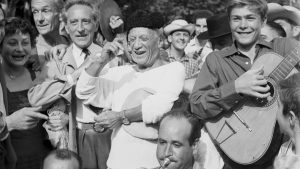 Picasso presides over a mock bullfight in Vallauris, France. Left of Picasso is the poet-playwright Jean Cocteau. Photo: Bettmann/Getty