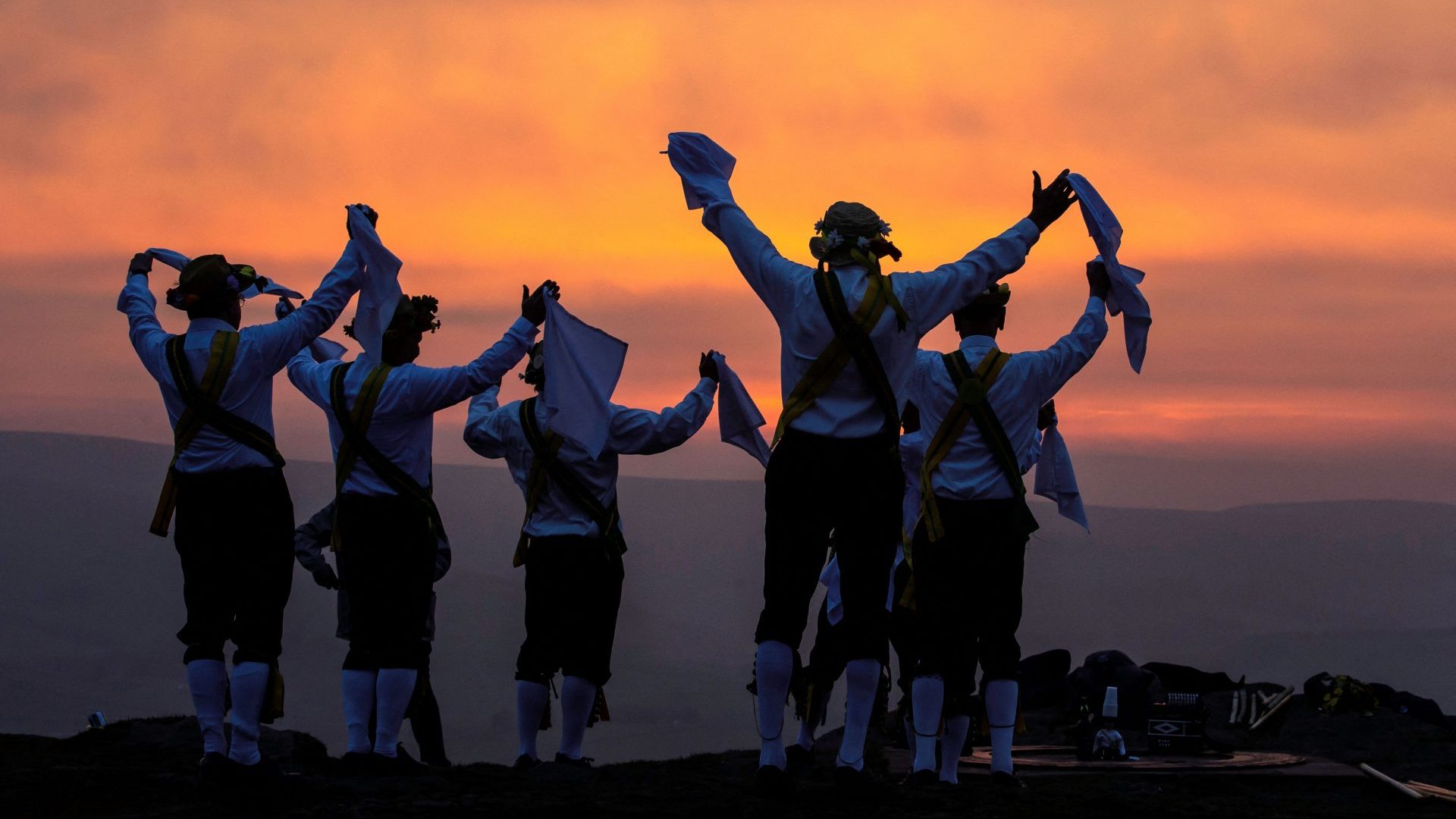 Members of the Chapel-en-le-Frith Morris Dancers dance atop the Eccles Pike at High Peak in Derbyshire before sunrise. Photo: LINDSEY PARNABY/AFP via Getty Images