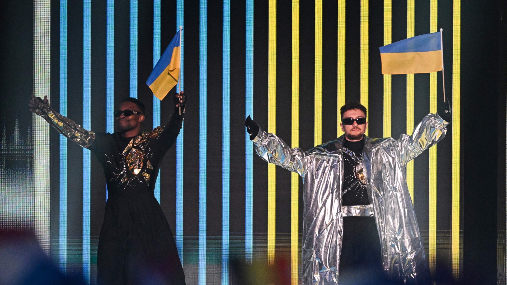 Ukraine's electronic duo Tvorchi wave their national flag during the Eurovision final in Liverpool, while their home town of Ternopil was hit by a barrage of Russian missiles. Photo: Oli Scarff/AFP/Getty 