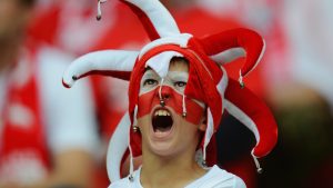 A Poland football fan cheers on his side as they take on Russia in a Euro 2012 match at the National Stadium in Warsaw. Photo: Shaun Botterill/Getty 
