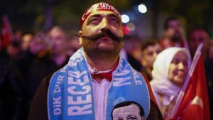 A supporter of Recep Tayyip Erdoğan celebrates his election victory at the AK Party headquarters in Istanbul. Photo: Jeff J Mitchell/Getty