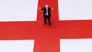 Boris Johnson outside 10 Downing Street with a giant St George's flag ahead of England's Euro 2020 quarter-final against Ukraine, June 2021. Photo: Simon Dawson/No10 Downing Street/Handout/Anadolu Agency/Getty