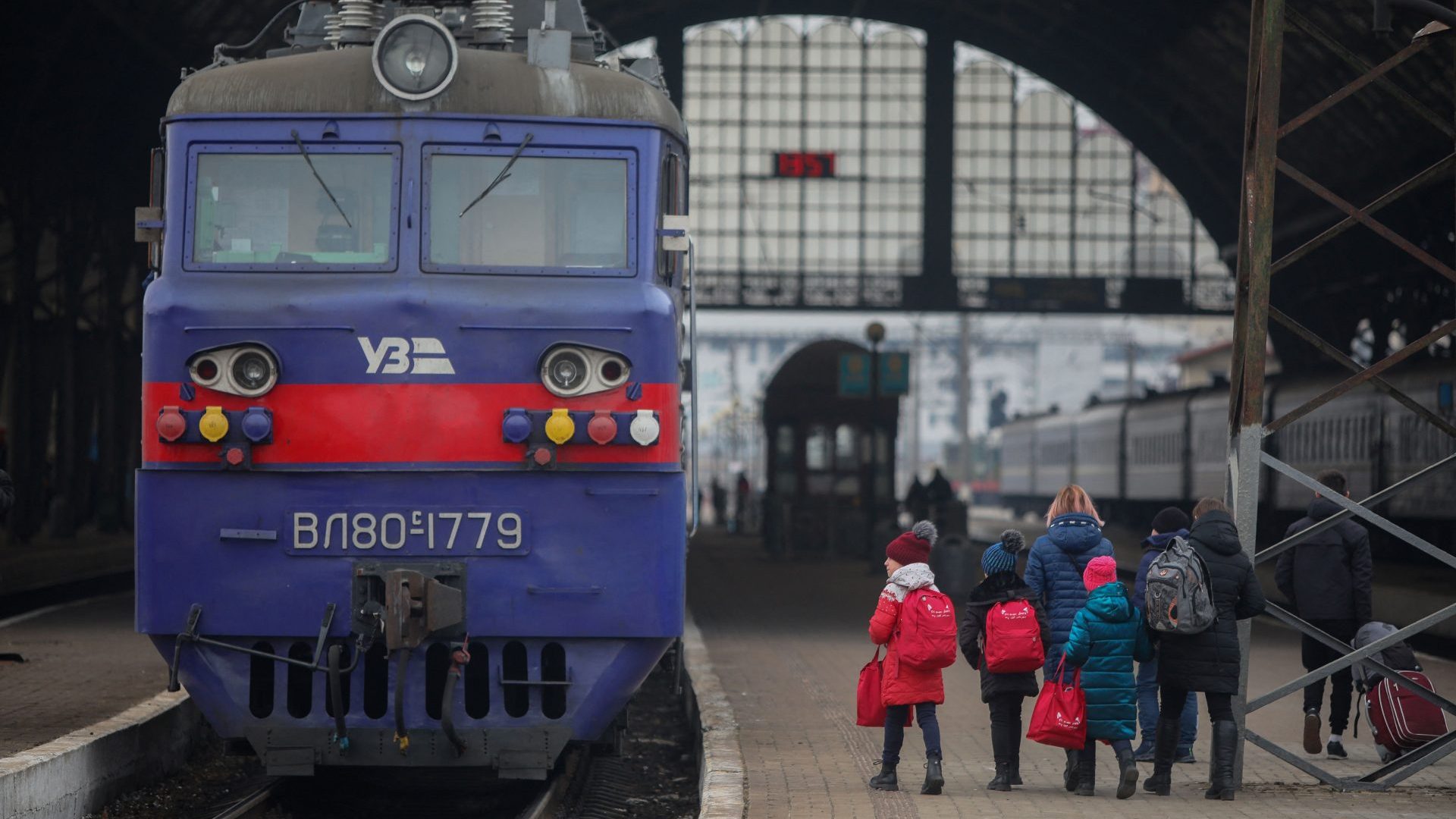 People walk on a platform at the train station of the western Ukrainian city of Lviv. Photo: ALEKSEY FILIPPOV/AFP via Getty Images