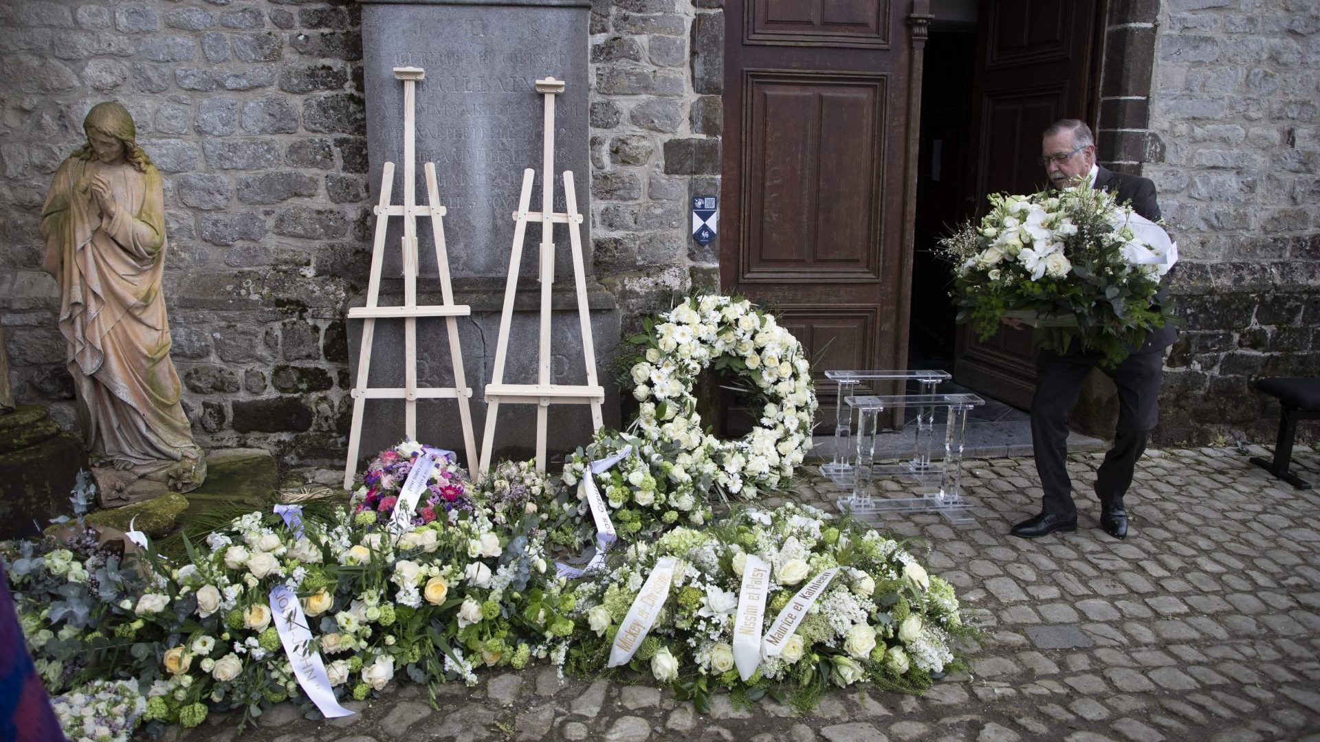 Flower wreaths pictured after the funeral ceremony for Baroness Myriam Ullens de Schooten in Lasne, Belgium, in April (Photo by NICOLAS MAETERLINCK/BELGA MAG/AFP via Getty Images)