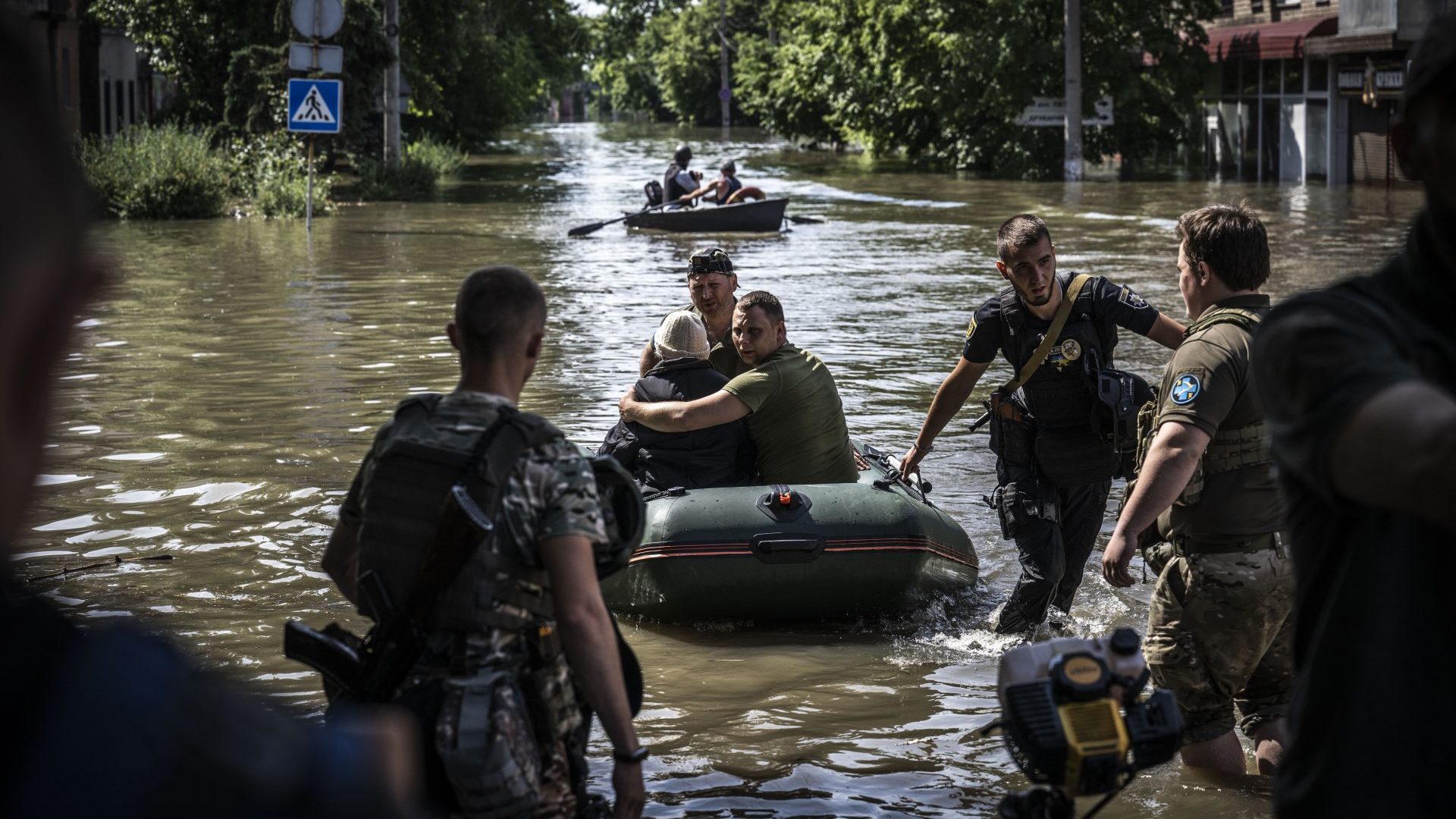 People being evacuated from flooded areas after the explosion at the Kakhovka hydropower plant unleashed floodwaters in Kherson. Photo: Muhammed Enes Yildirim/Anadolu Agency via Getty Images