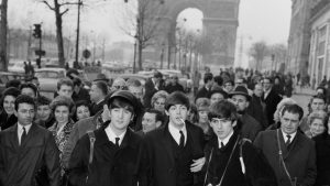 John Lennon, Paul McCartney and George Harrison arrive in Paris, January 15, 1964. Photo: Keystone-France/Gamma-Rapho/Getty