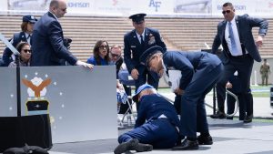 Joe Biden is helped up after falling during a graduation ceremony at the US Air Force Academy in Colorado. Photo: Brendan Smialowski/AFP/Getty