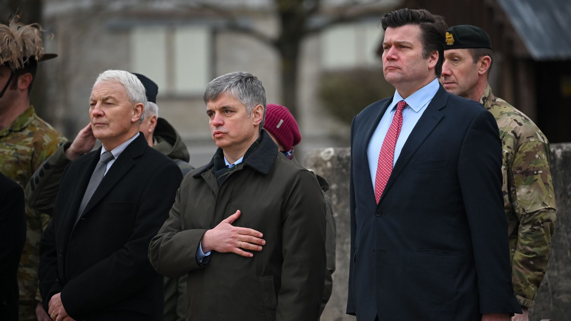 Ukrainian Ambassador to the UK, Vadym Prystaiko and Minister for the Armed Forces James Heappey during the Ukrainian National Anthem during a service in February near Salisbury ahead of the anniversary of the Russia invasion. Photo: Finnbarr Webster/Getty Images