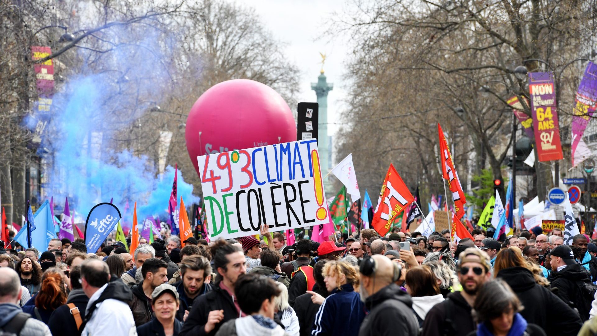 A sign reads: "49°3 Climate of anger!" during the demonstration in Paris against the reform extending the retirement age to 64. Photo: Fred VIELCANET/Gamma-Rapho via Getty Images