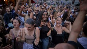 Parisians dance in the street in Montmartre as part of Fête de la Musique. Photo: Kiran Ridley/Getty Images