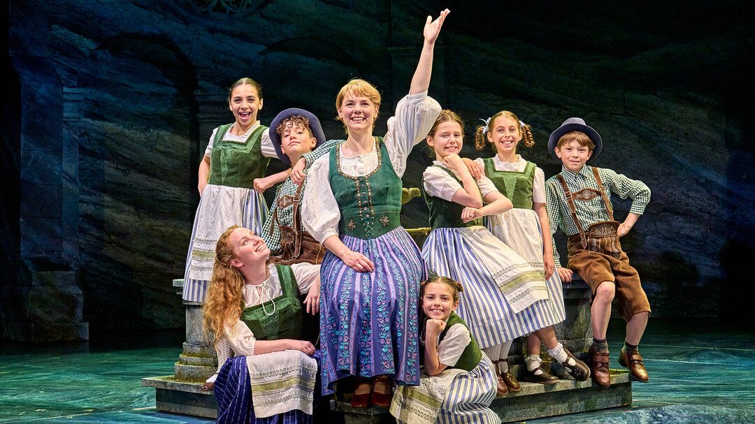 Gina Beck as Maria with the von Trapp children in Adam Penford’s production of The Sound of Music. Photo: Manuel Harlan