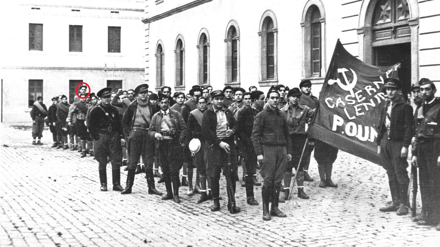 George Orwell stands in the background as militia guard the 
headquarters of POUM – the Workers’ Party of 
Marxist Unification – in Barcelona in 1936. Photo: Universal 
History Archive/
Getty