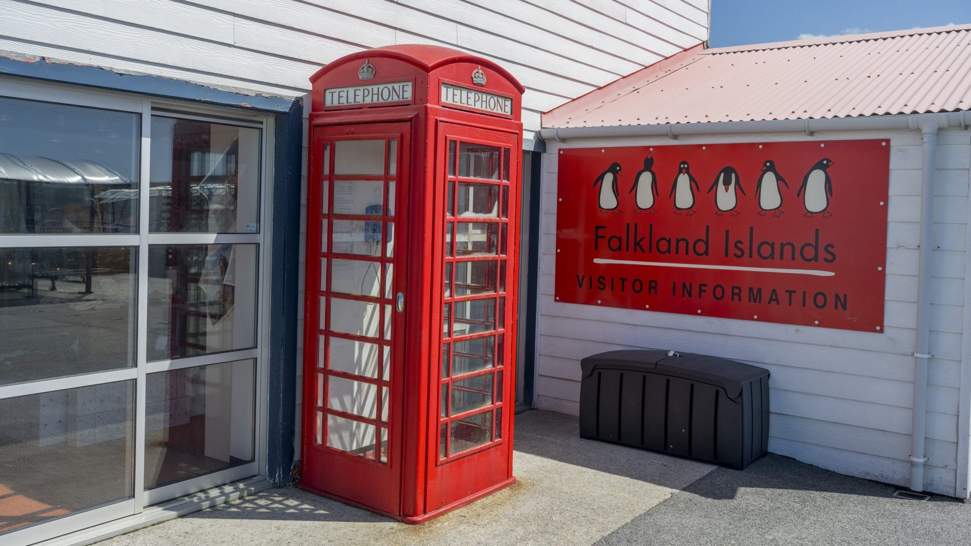 A United Kingdom phone box in front of a house on Ross Road in Port Stanley, Falkland Islands. Photo: Wolfgang Kaehler/LightRocket via Getty Images