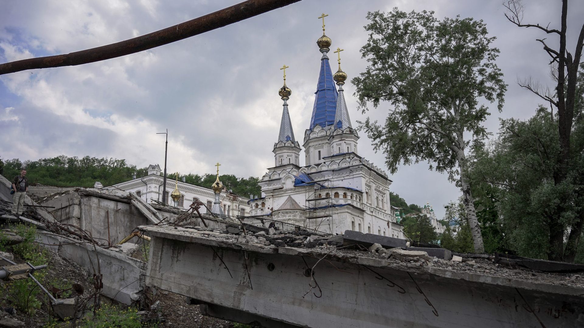 A destroyed bridge near a monastery in the ruined town of Sviatohirsk in Ukraine's Donbas Region. Until Ukraine's army liberated the city just a few months ago, it was occupied by Russian forces. Photo: Mihir Melwani/SOPA Images/LightRocket via Getty Images