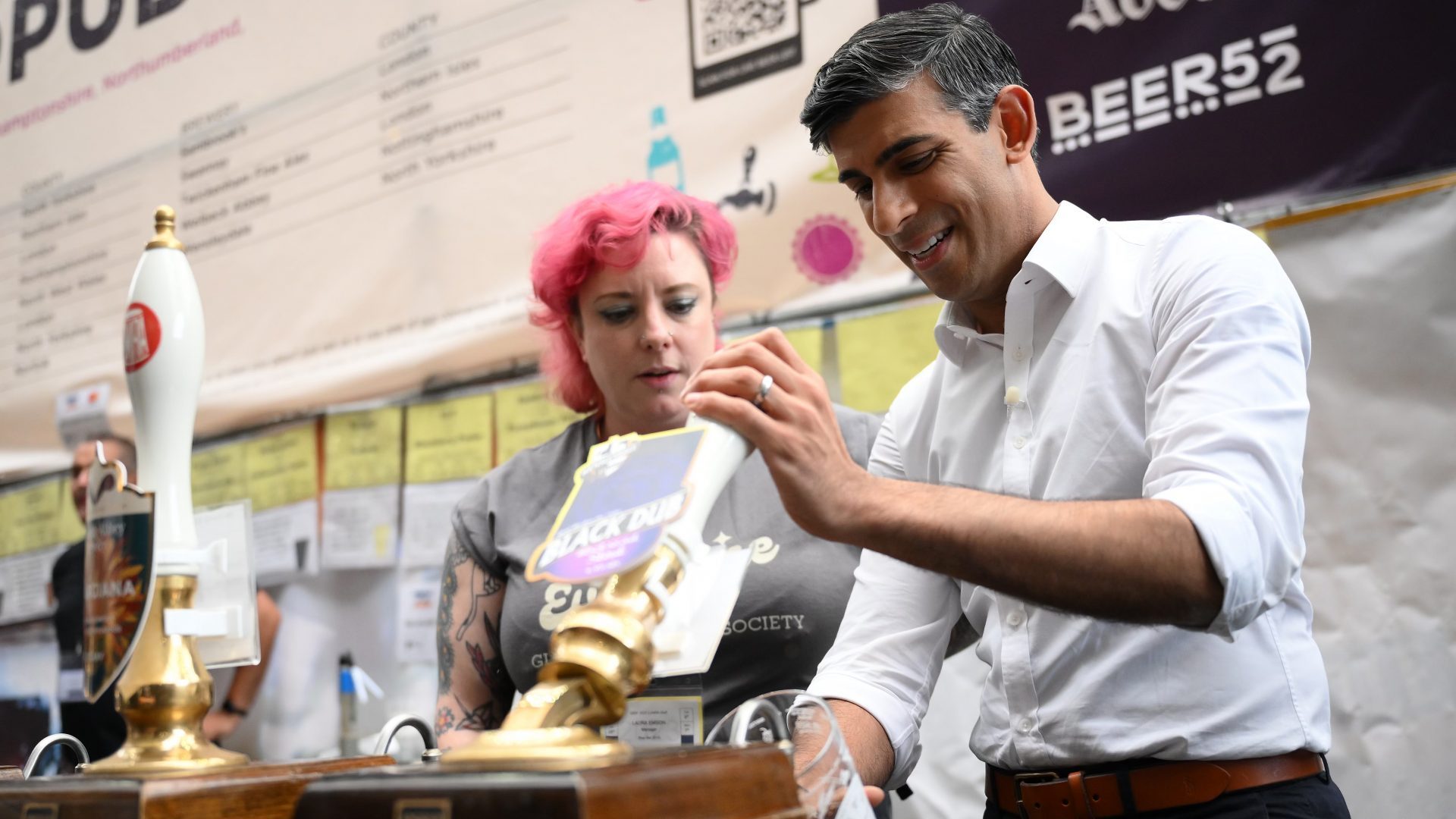 Rishi Sunak pours a pint of Black Dub stout during a visit to the Great British Beer Festival. Photo: Daniel Leal - WPA Pool/Getty Images