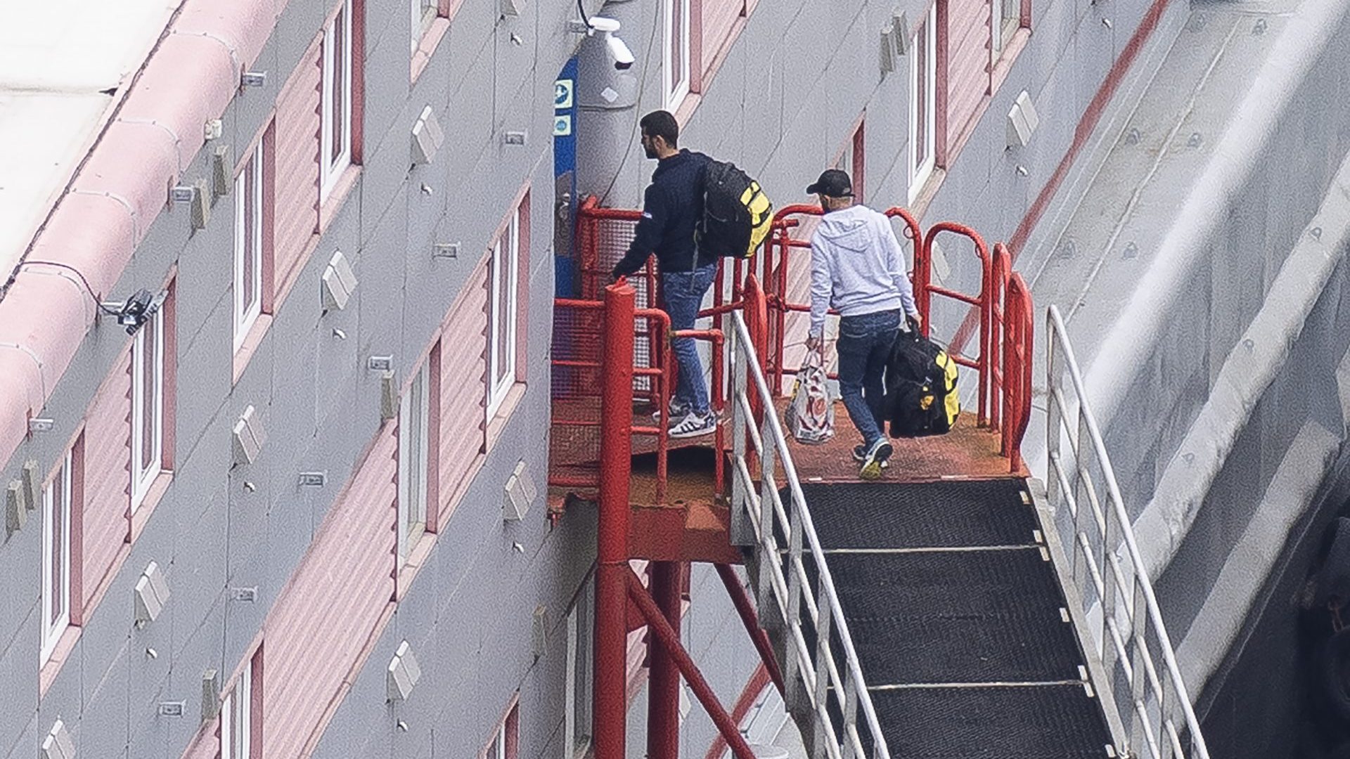 People board the Bibby Stockholm immigration barge. Photo: Dan Kitwood/Getty images