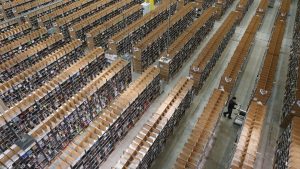 A worker is almost lost among shelves at an Amazon warehouse in Germany, which has a higher productivity rate than the UK. Photo: Sean Gallup/Getty