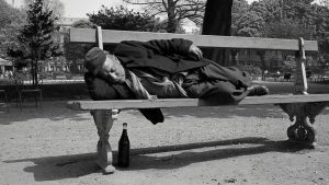 A homeless man takes a nap on a bench in Paris, c1960. Photo: adoc-photos/Corbis/Getty