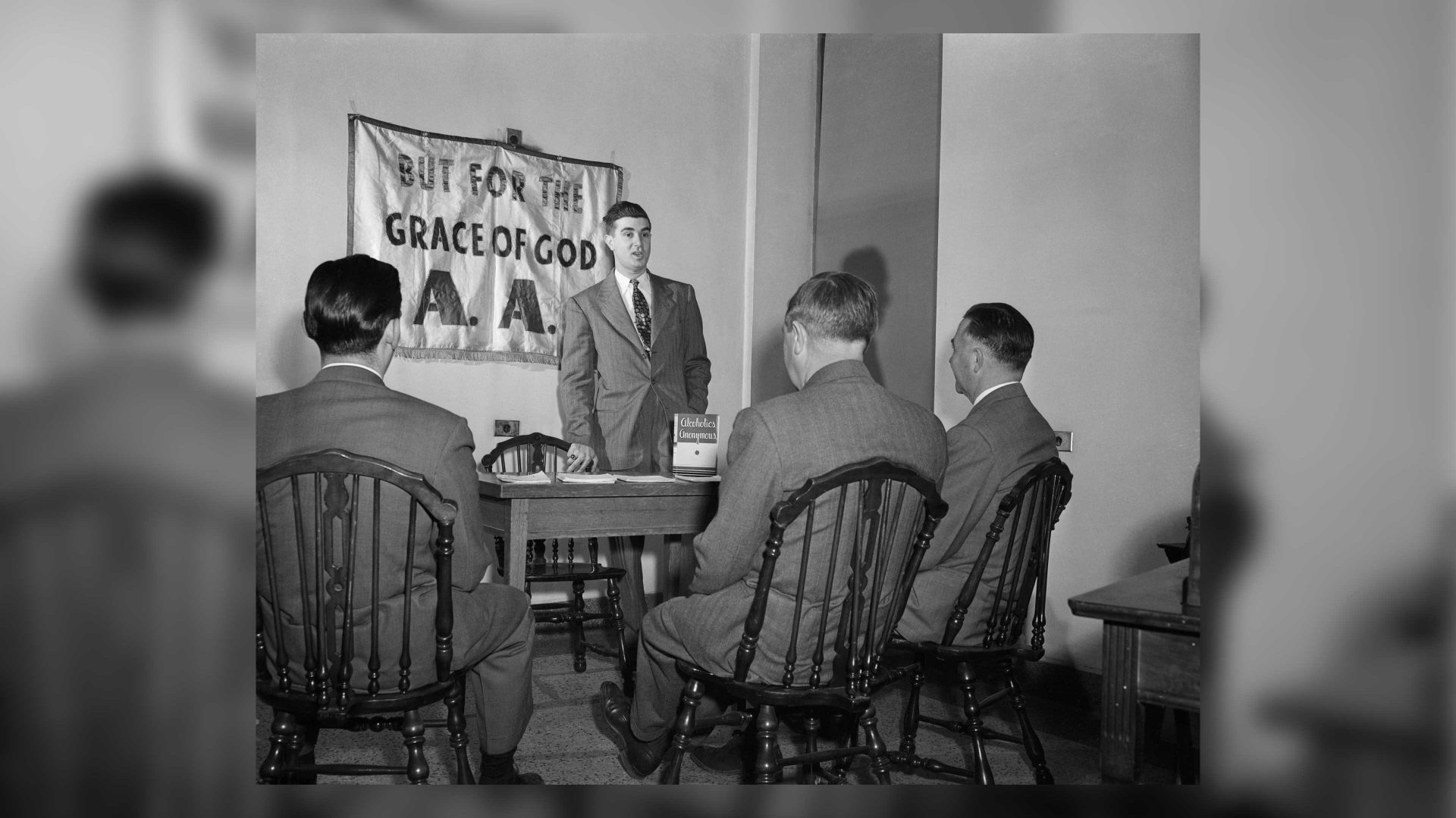 After three months without a drink, John finds himself an Alcoholics Anonymous crusader, helping the good work of saving others by telling of his successful fight. Photograph circa 1950. GETTY