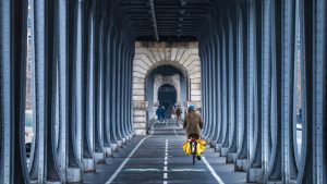 A lone cyclist on the Pont de Bir-Hakeim bridge in Paris. Photo: Kevin Gorton/Getty