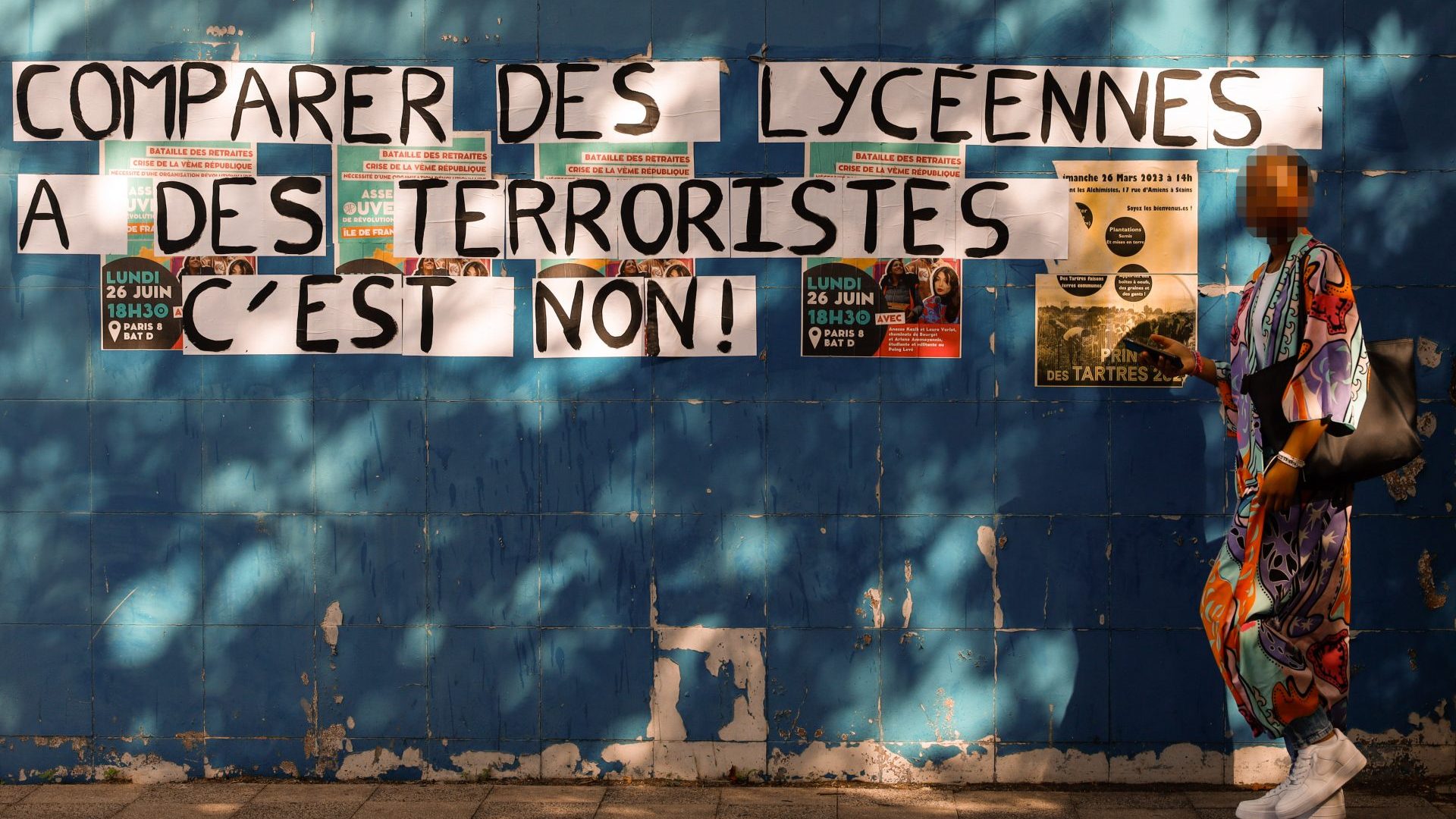 Staff at the Maurice-Utrillo high school in Seine-Saint-Denis, Paris, organised a strike over the government’s abaya dress ban in schools. The sign reads ‘Don’t compare high-school girls to terrorists’. Photo: Ameer Alhalbi/Anadolu Agency/Getty