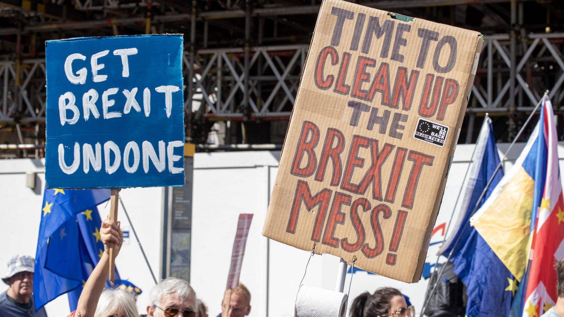 Protesters hold placards expressing their opinion during the march. Photo: Krisztian Elek/SOPA Images/LightRocket via Getty Images