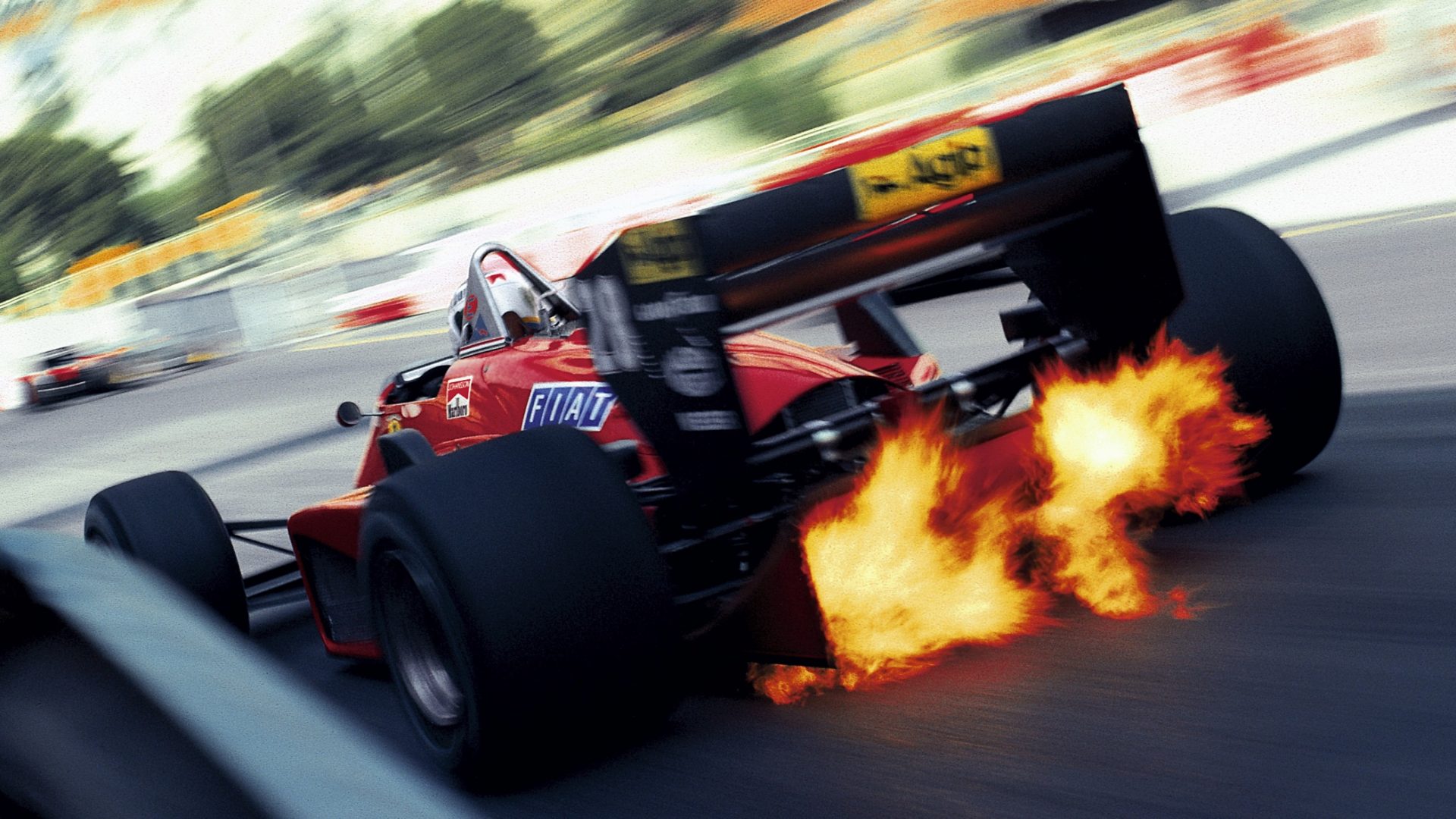 Exhaust flames shoot up through the diffuser of Stefan Johansson’s Ferrari 156-85 during the 1985 Monaco Grand Prix. Photo: Motorsport Images/Rainer Schlegelmilch
