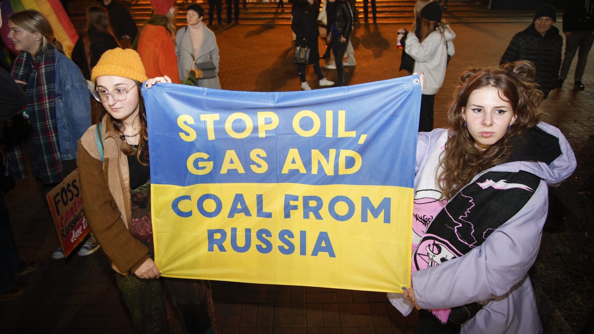 Protesters hold up signs as they take part in the 'Crisis Strike', a demonstration against the passivity of the Polish government in the face of the challenges related to the war in neighbouring Ukraine. Photo: STR/NurPhoto via Getty Images