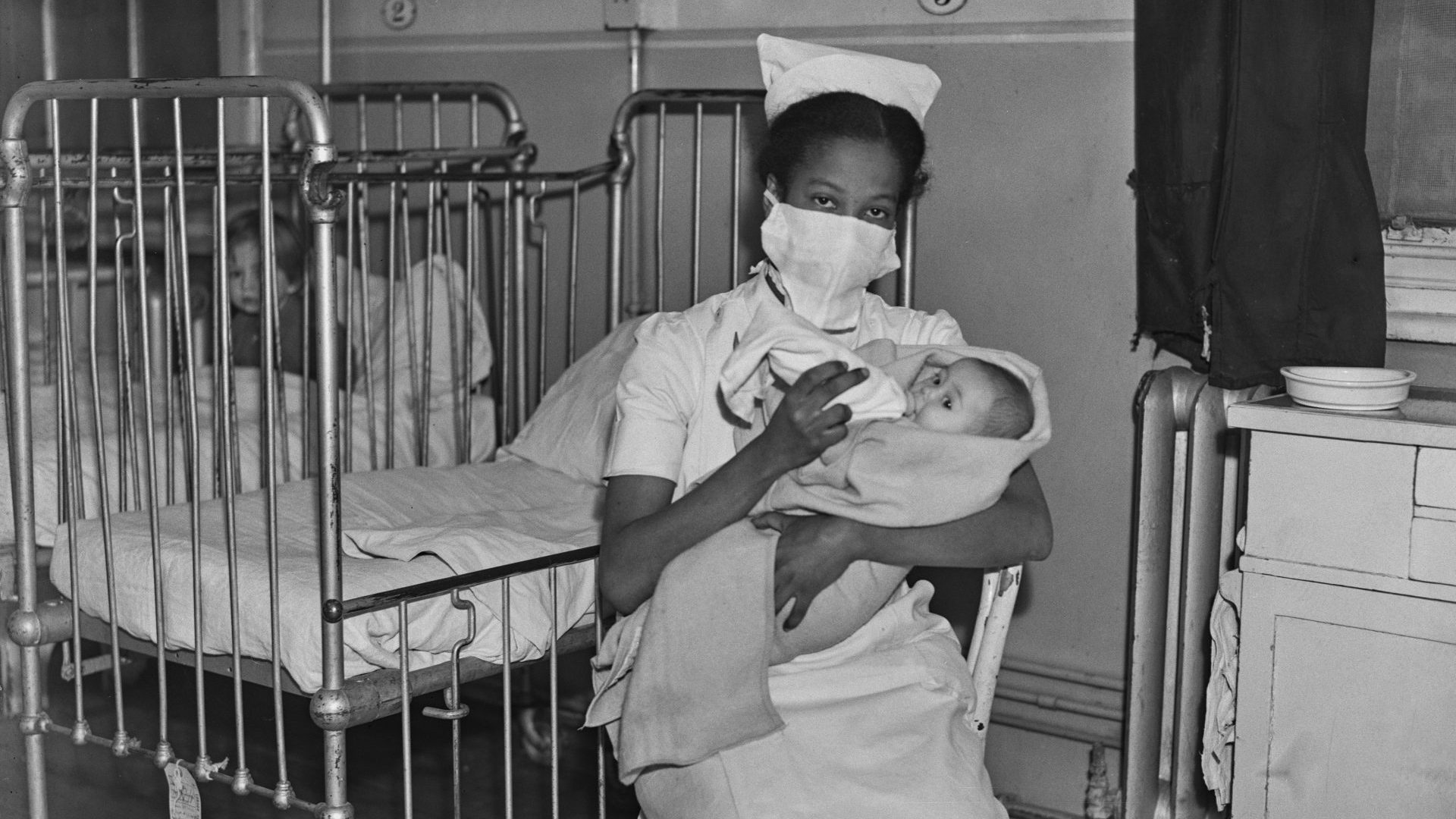 A nurse from Saint Kitts feeds a baby on a children’s ward in London, March 1945. Nostalgia for the supposedly monocultural Britain of yesteryear is misguided at best. Photo: Keystone/Hulton Archive/Getty